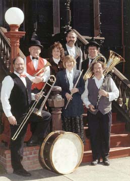 Humboldt Ragtime Band posing on steps with instruments